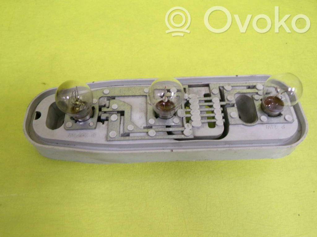 Tail light bulb cover holder