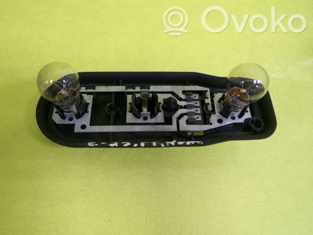Tail light bulb cover holder
