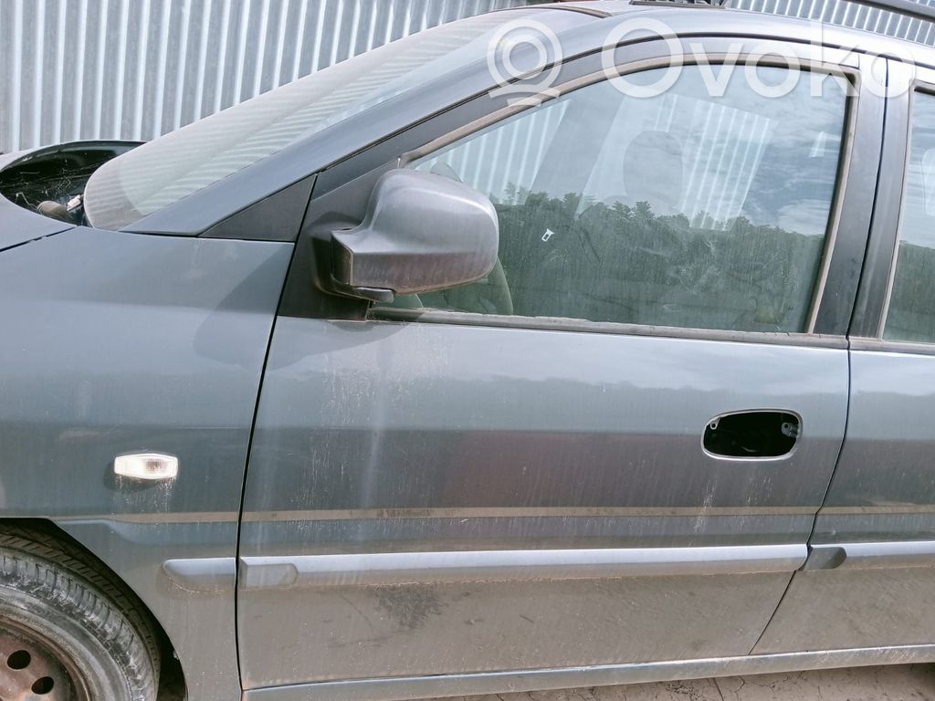 Regulador de puerta delantera con motor