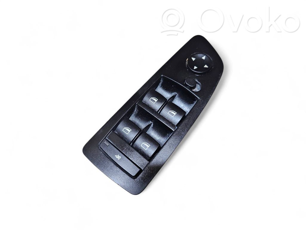 Electric window control switch   6952039