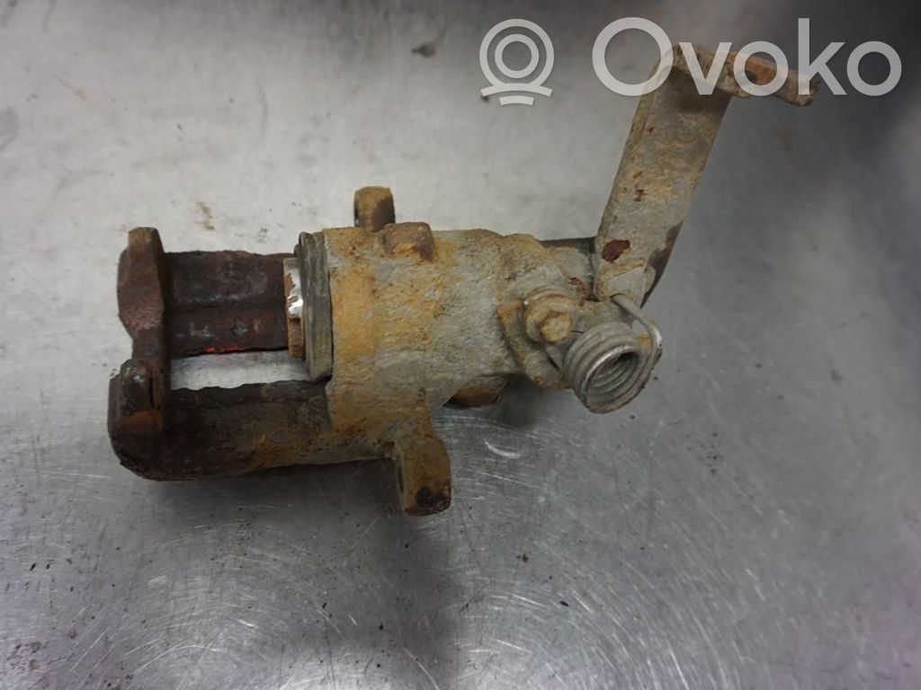 Nissan Primera Tylny zacisk hamulcowy 