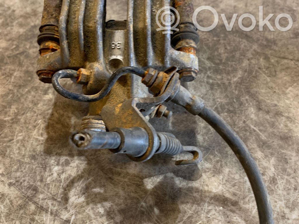 Volkswagen Golf V Tylny zacisk hamulcowy 