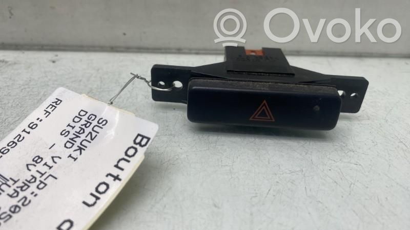 Suzuki Grand Vitara II Botón interruptor de luz de peligro