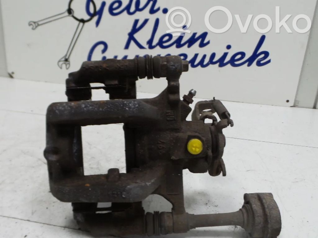 Opel Astra J Caliper del freno trasero 