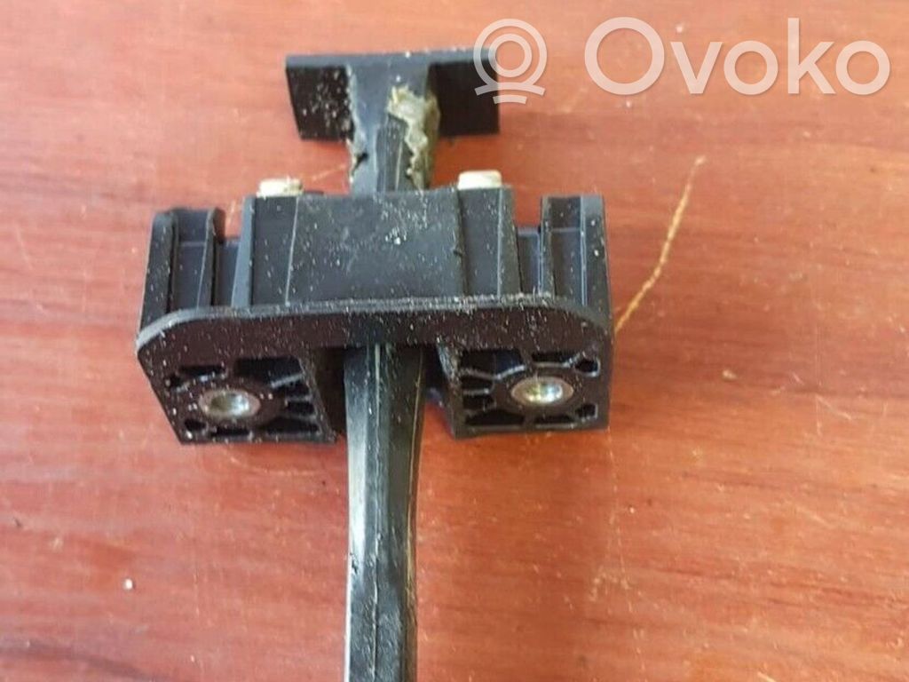 Front door check strap stopper   7176809