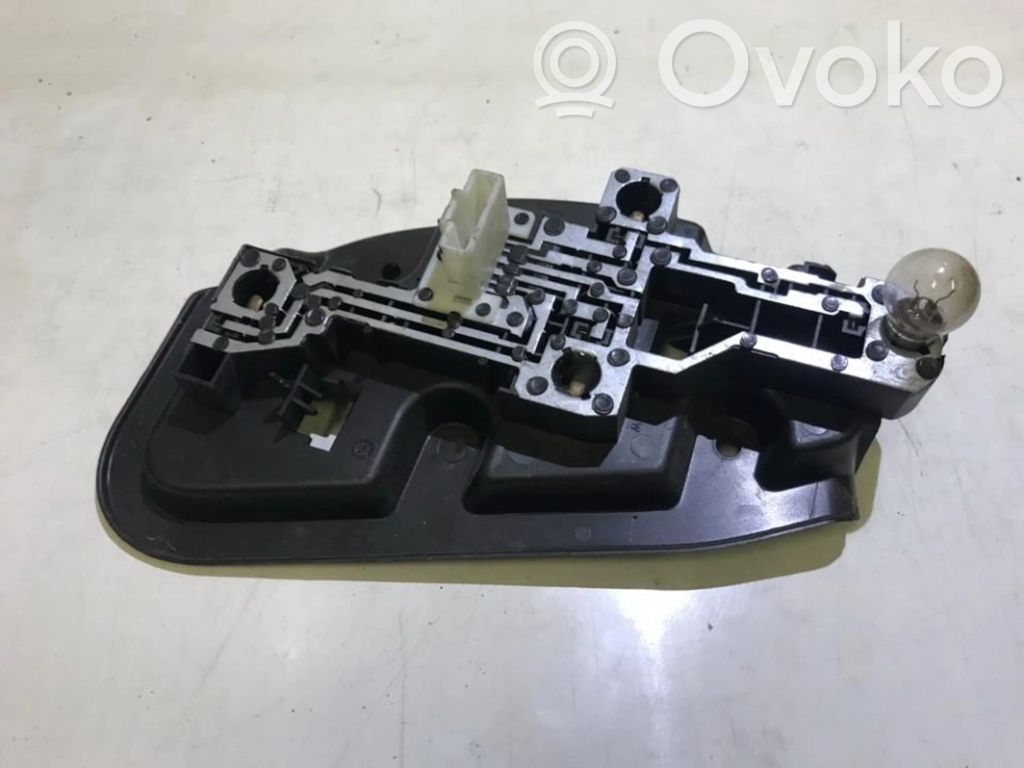 Tail light bulb cover holder