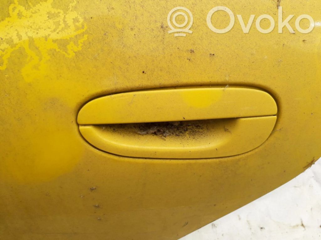 Manecilla externa puerta delantera