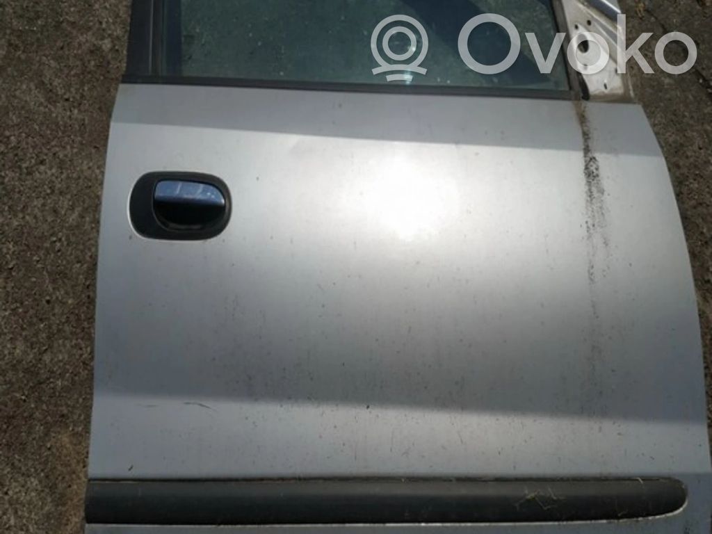 Nissan Almera Tino Передняя дверь 