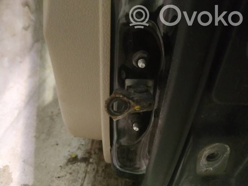 Front door check strap stopper