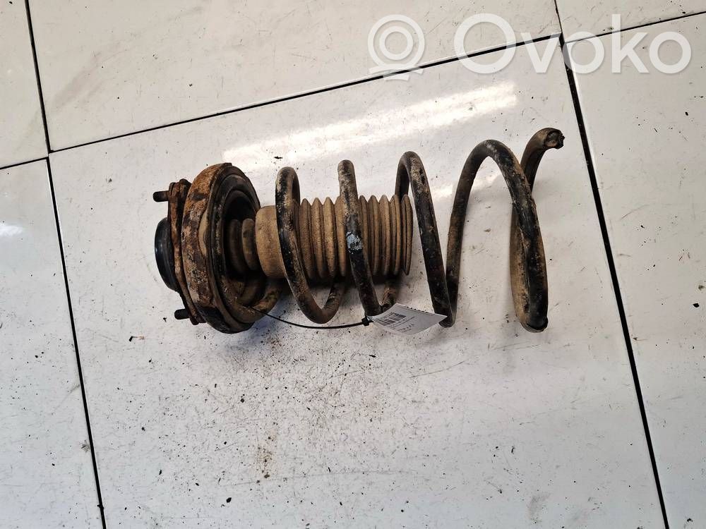 Nissan X-Trail T30 Arc elicoidal spate 