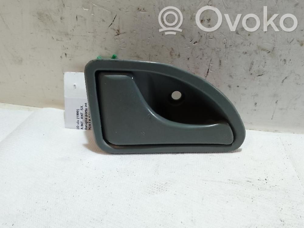 Renault Twingo I Klamka wewnętrzna drzwi przednich 