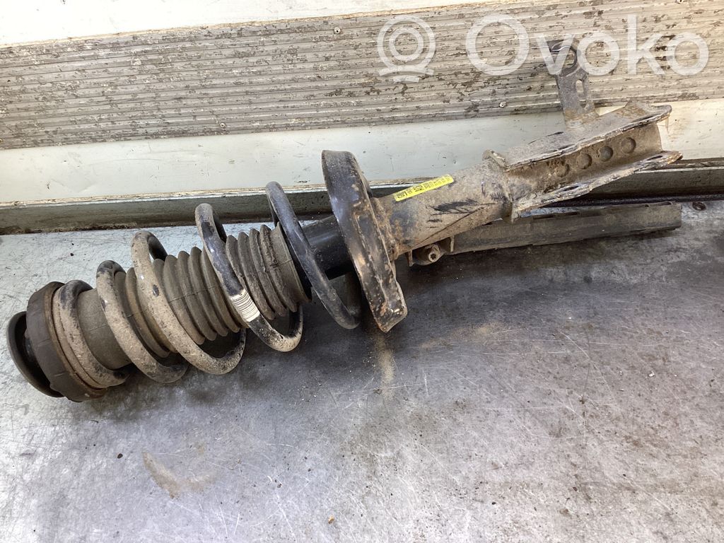 Opel Zafira C Amortyzator osi przedniej ze sprężyną 