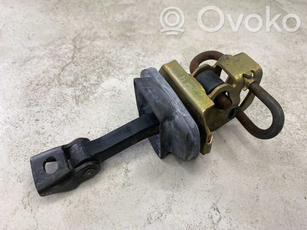 Front door check strap stopper   8160959