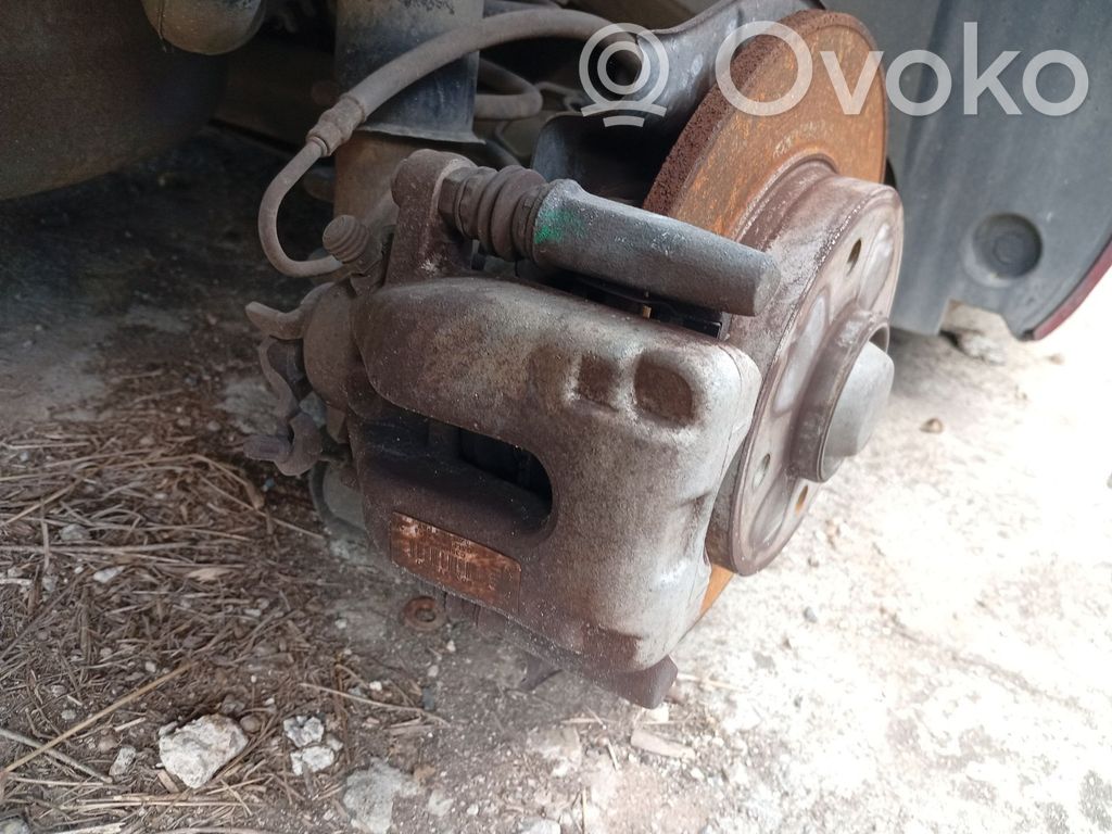 Citroen C4 I Picasso Jarrusatulan tyynyn pidike takana 