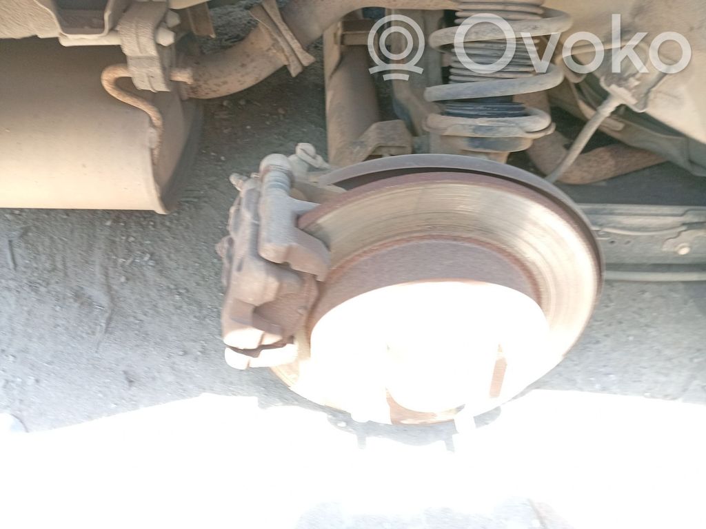 Nissan Almera N16 Mocowanie / Zacisk hamulca tylnego 