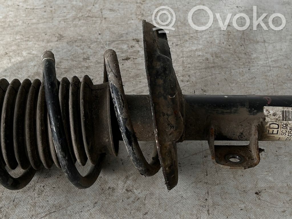 Opel Corsa D Etuiskunvaimennin kierrejousella 