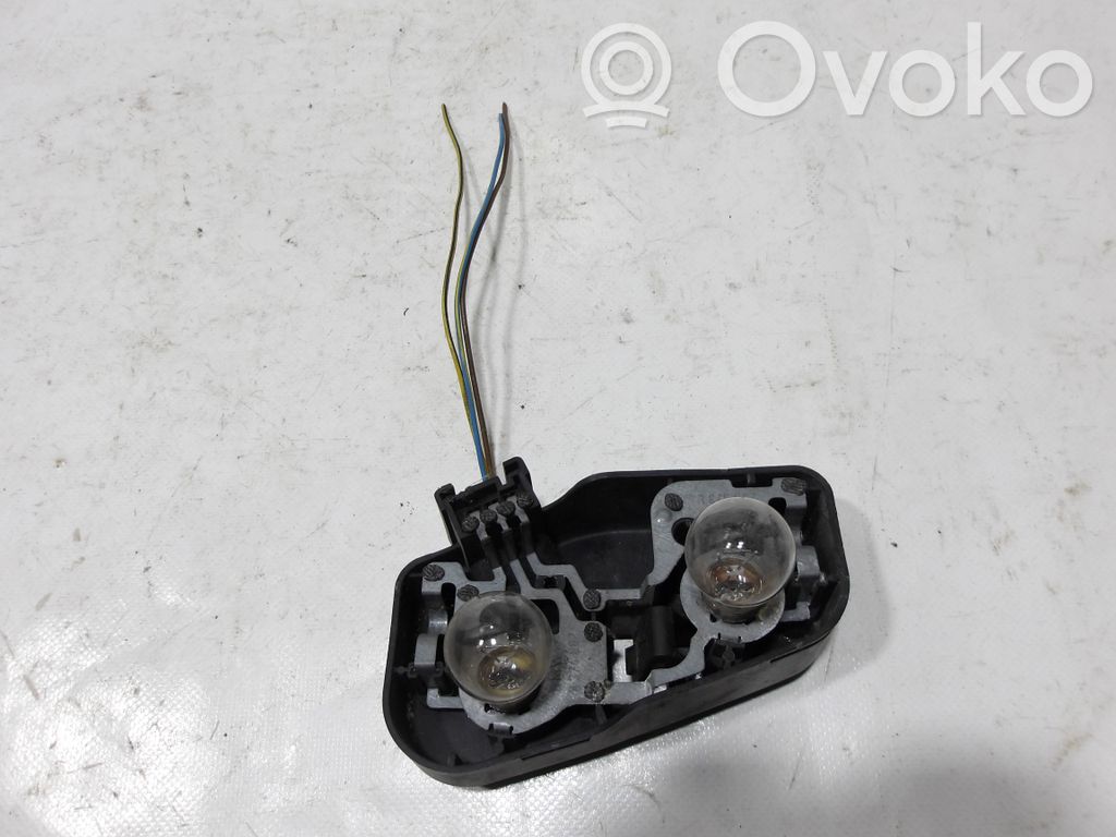 Tail light bulb cover holder