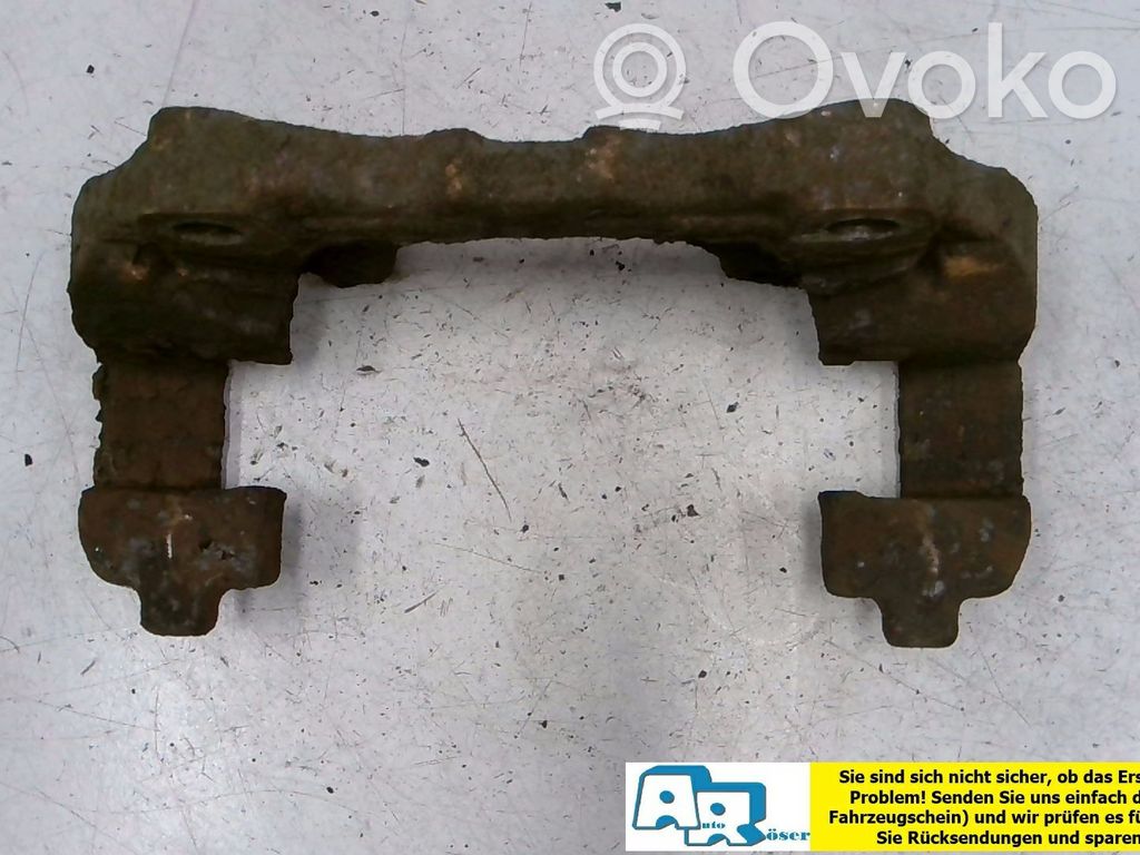 Opel Astra G Mocowanie przedniego zacisku hamulca 