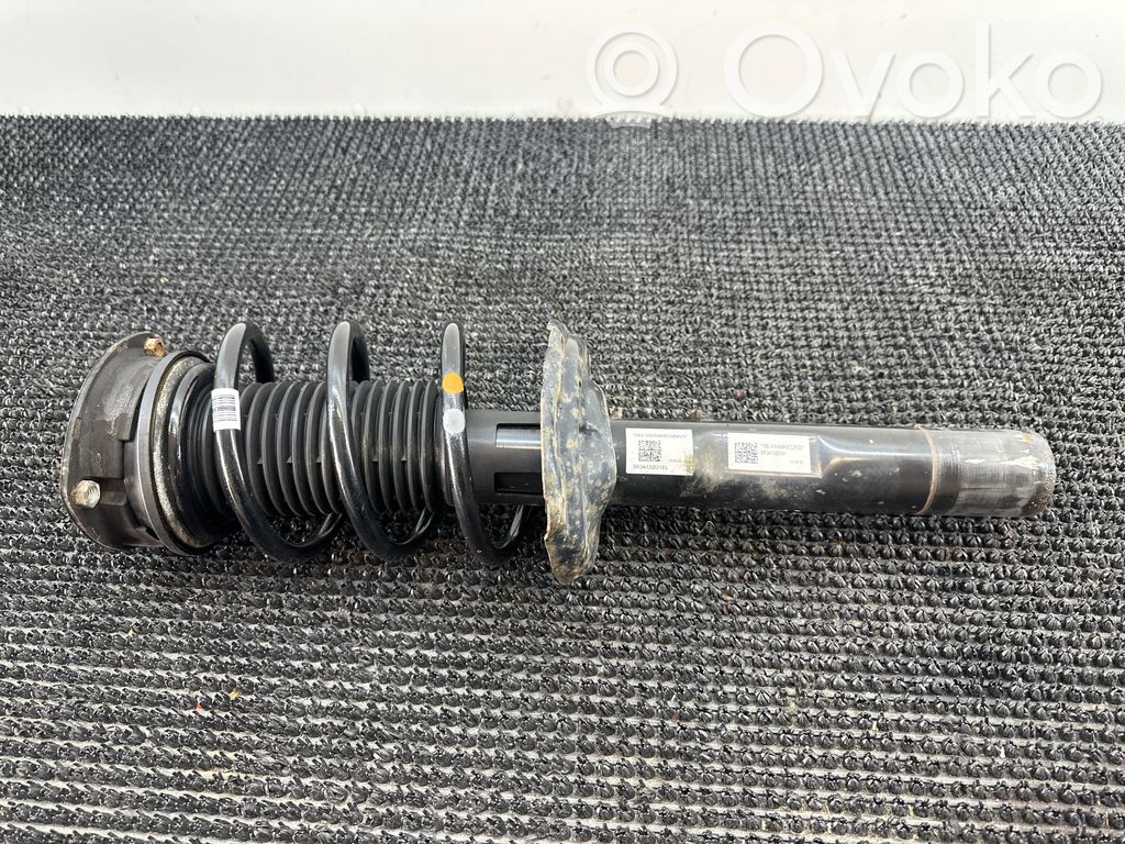 Volkswagen Caddy Amortyzator osi przedniej ze sprężyną 