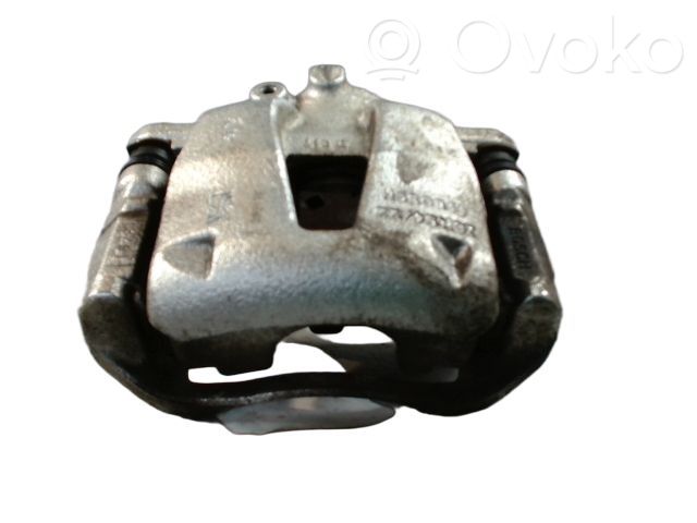 Opel Corsa D Zacisk hamulcowy przedni 