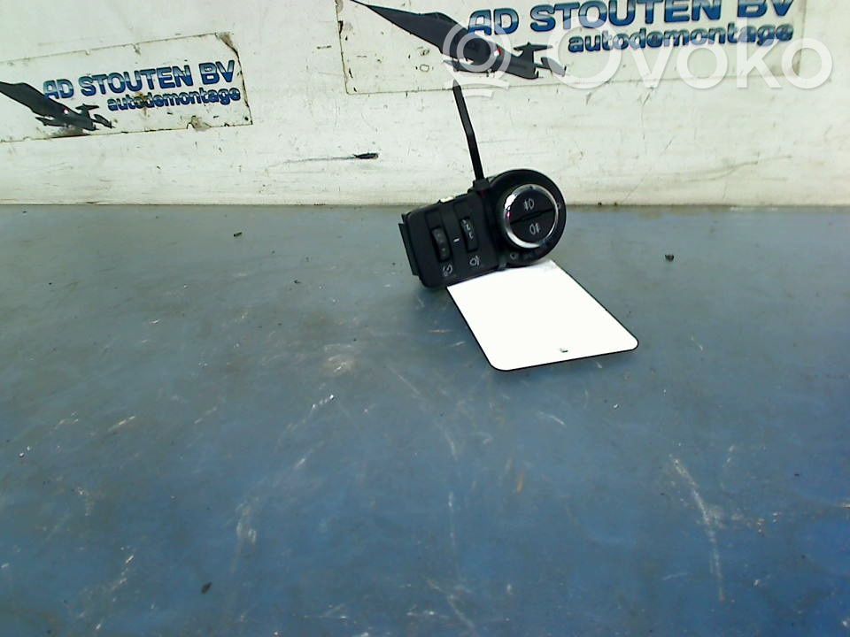 Opel Astra J Interruptor de control de altura del faro delantero 