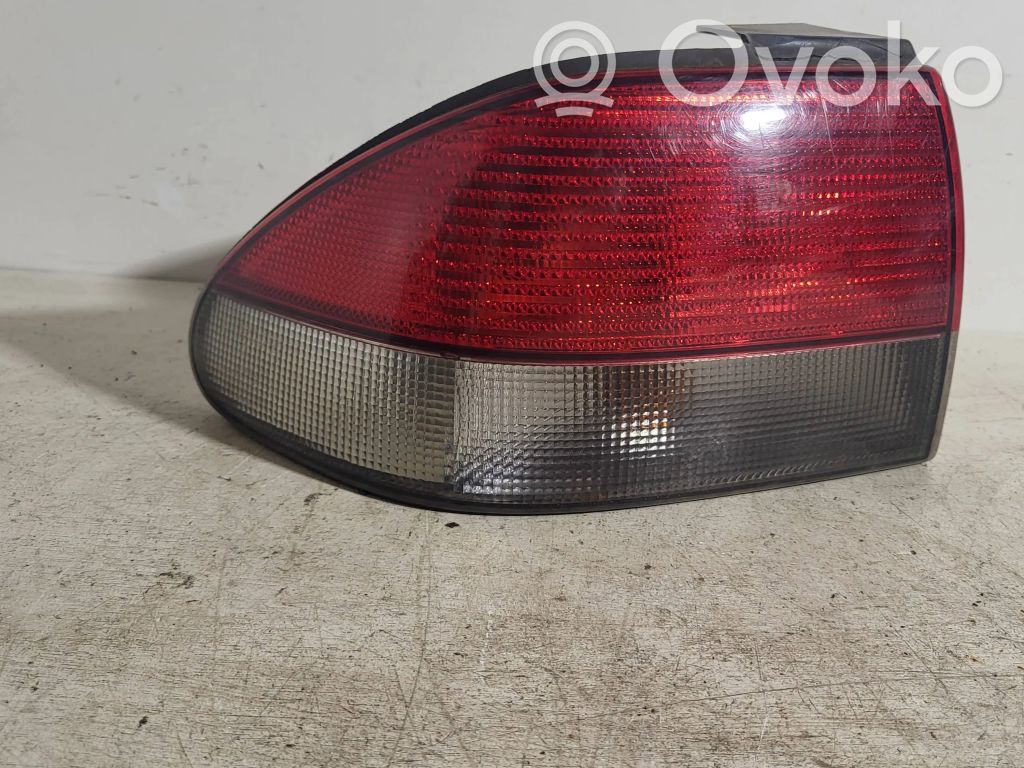 Saab 9-3 Ver1 Takavalon polttimon suojan pidike 