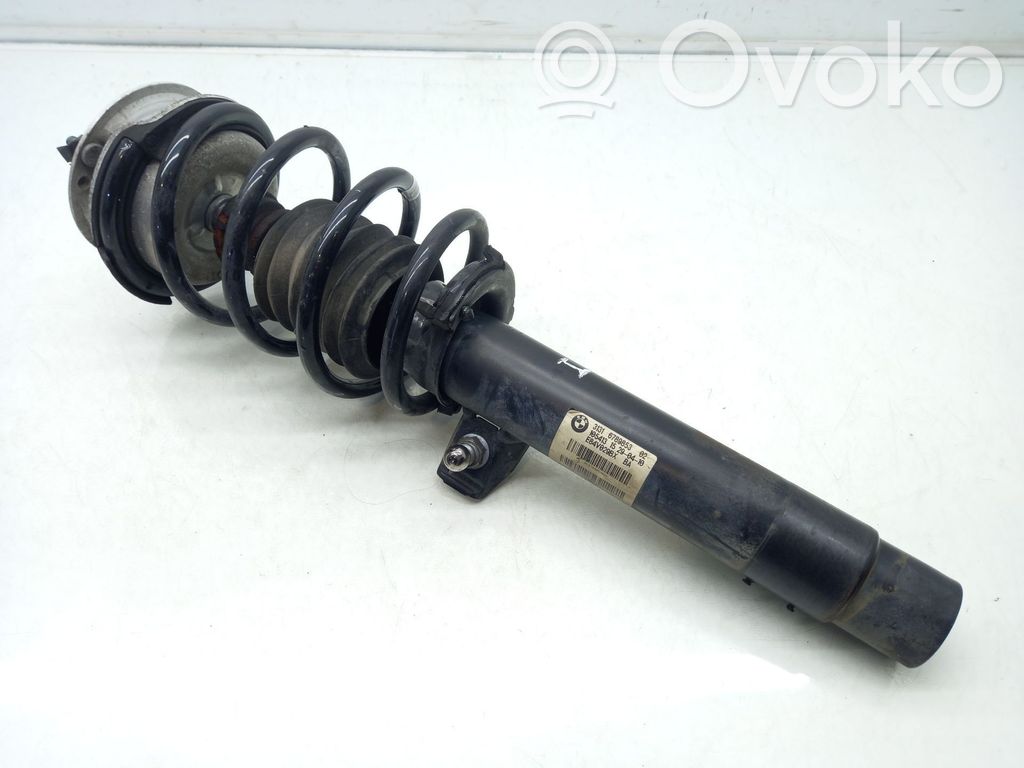 Front shock absorber with coil spring   6789853,E84V029BX
