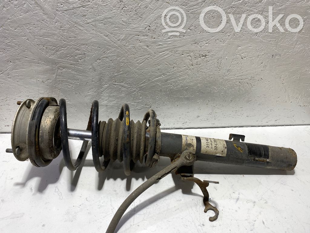 Front shock absorber with coil spring   311403,32L35A,824903002483