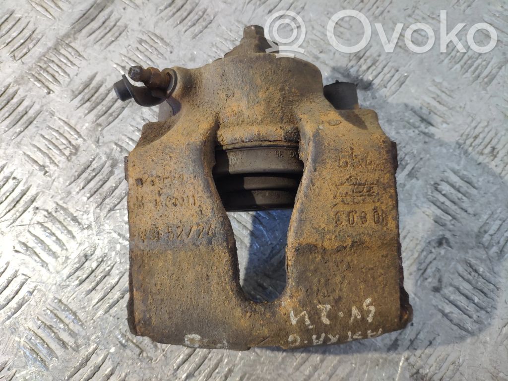 Opel Astra G Zacisk hamulcowy przedni 
