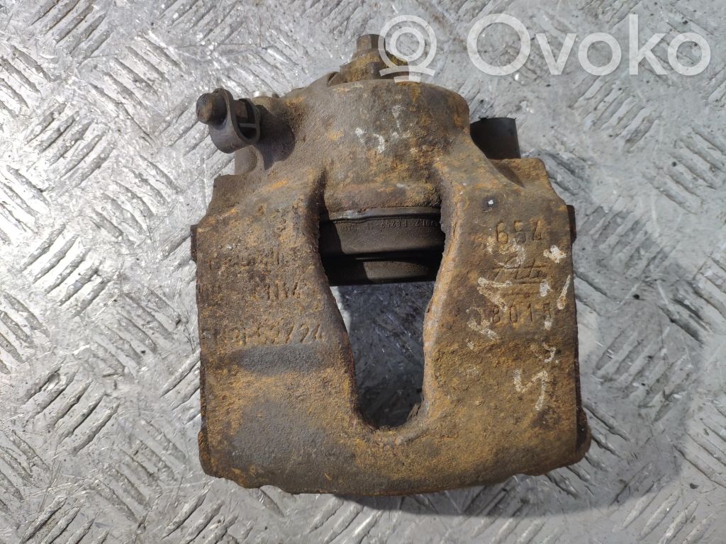 Opel Astra G Zacisk hamulcowy przedni 